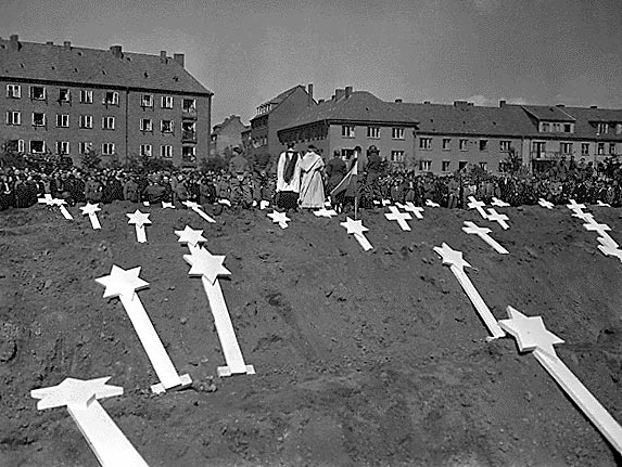Grave markers for the 80 victims of the Nazis.