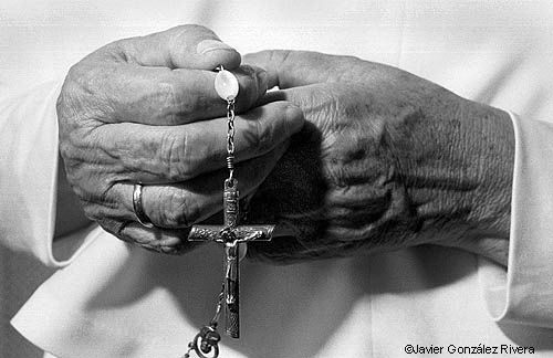 Hands and Crucifix - photograph by Javier Gonzalez Rivera.