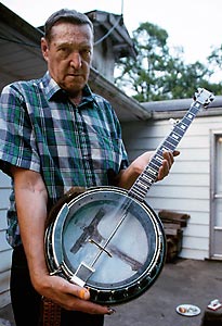 Dave Bailey holding Russell Cox's banjo